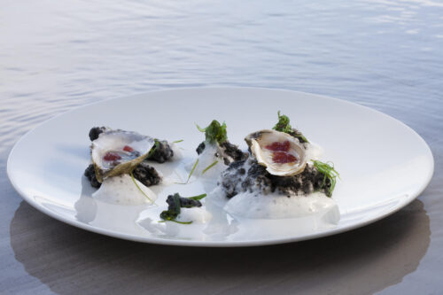 Oysters with Mignonette Gelee Presented in their  "Natural Setting," Squid Ink "Rocks," Verjus Sea Froth, Wakame by Chef Brad Kilgore. Photo by Battman.