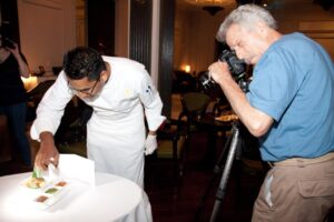Exec Chef Ashfer Biju makes sure the samosas look their best. Battman behind the lense.