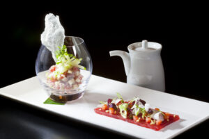 Saku Tuna Two Ways: Sashimi of Tuna with Tomatoes, Coconut, Chili Oil and Ceviche of Tuna with Yuzu, Green Apple, and Rice Paper Chips from Executive Chef Ashfer Biju