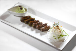 Angus Beef Negimaki with Soy & Ginger, Wasabi Avocado Cream, and Daikon Salad by Executive Chef Ashfer Biju