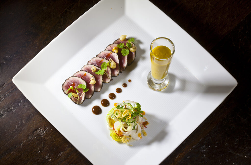 Tuna Carpaccio with a Tamarind Soy Sauce, Mango-Basil Gazpacho, and Palm Hearts Salad from Executive Chef Ashfer Biju