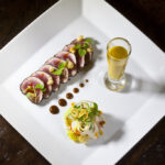 Tuna Carpaccio with a Tamarind Soy Sauce, Mango-Basil Gazpacho, and Palm Hearts Salad from Executive Chef Ashfer Biju