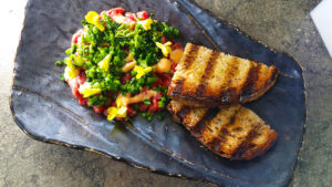 Beef Tartar, Broccoli rabe, Grilled Sour Dough by Chef Suzanne Cupps. Photo by Battman.