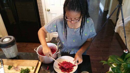 Haile Thomas preparing her Beet Pasta for photo shoot with Battman.
